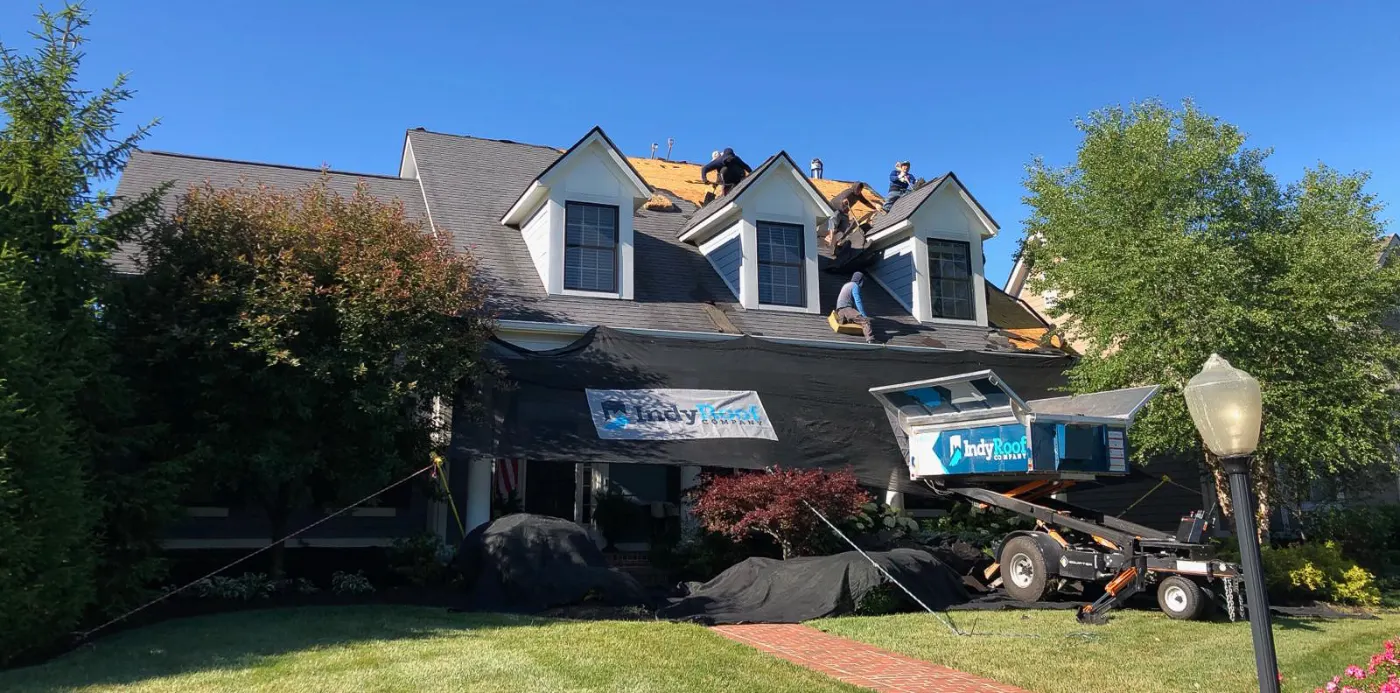 Tarping and dry-in on a Featherstone commercial roof